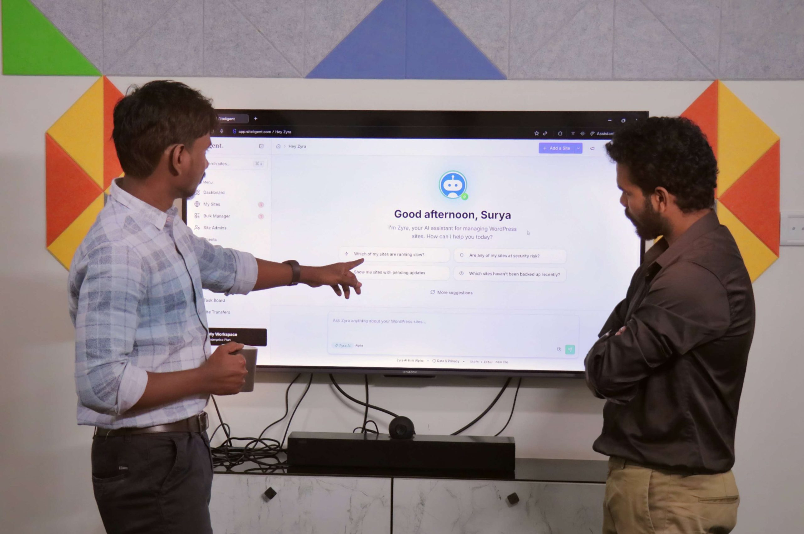 Siteligent team collaborating on WordPress management platform, demonstrating AI-powered automation and expert support.